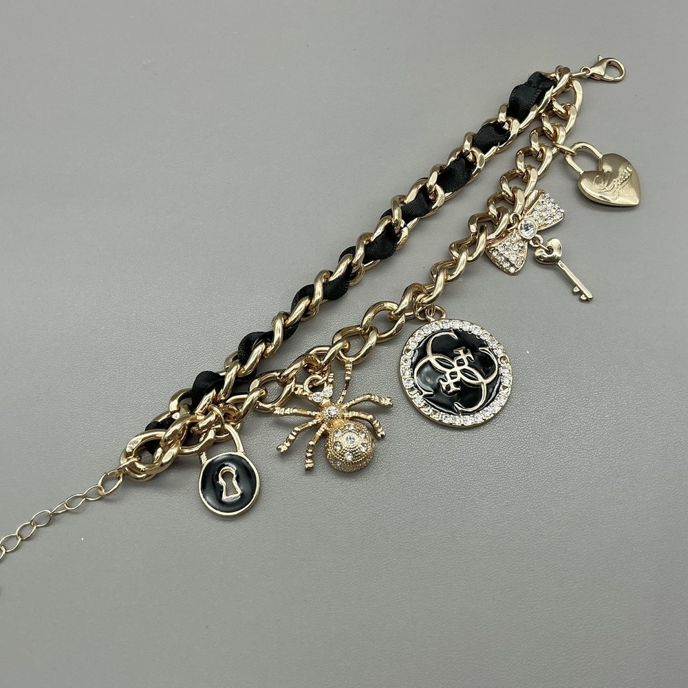Guess Bracelet Gold Tone Black Enamel Crystal Spider Logo Charm‎ Womens Fashion - Picture 4 of 8